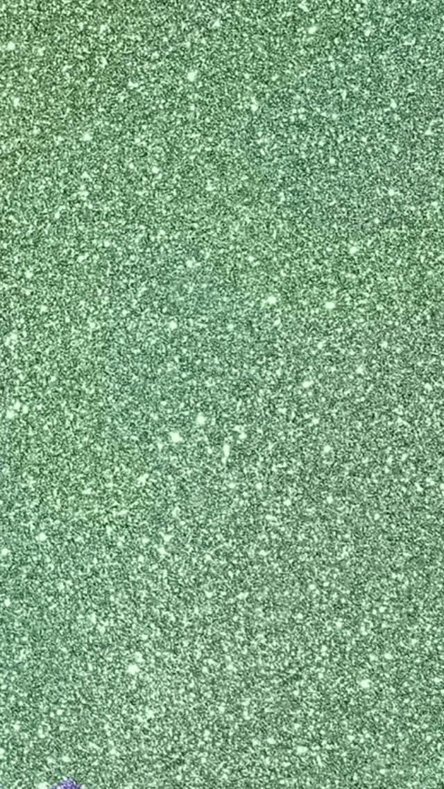 Bakgrunn med blekgrønn glitter i portrettformat Bakgrunner