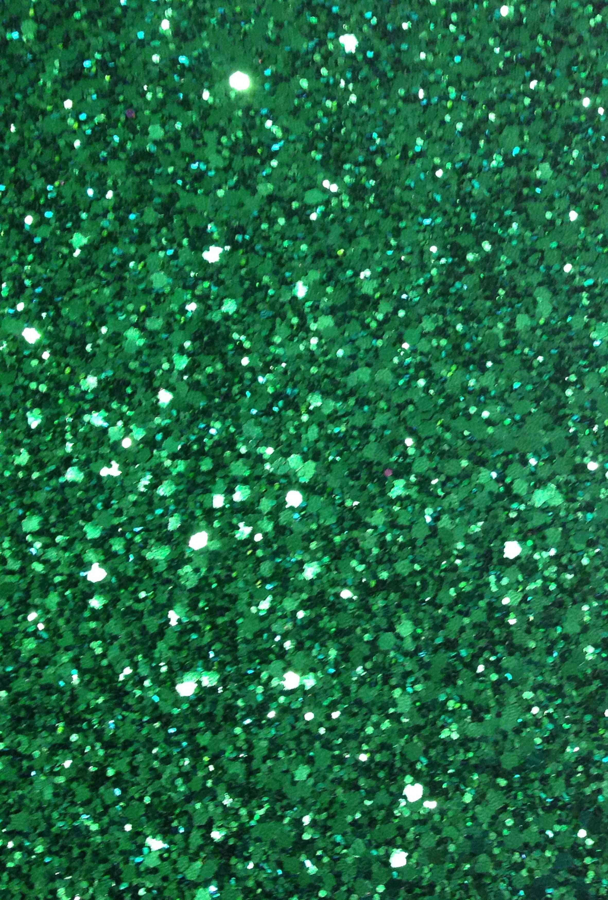 Bakgrunn med paljetter i smaragdgrønt glitter Bakgrunner