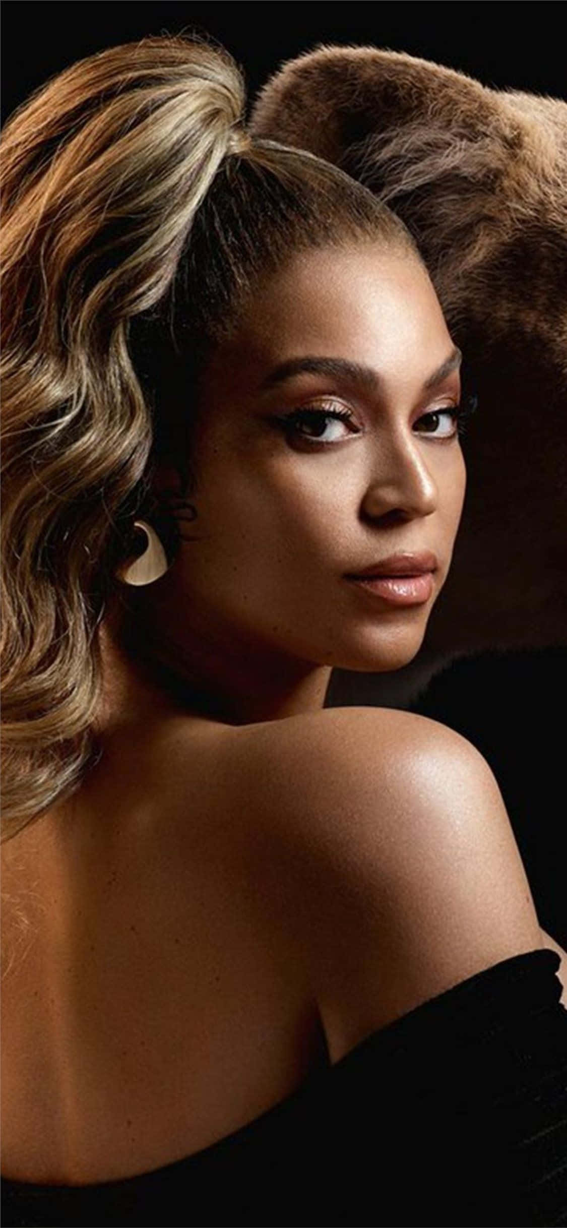 Beyoncé utstråler magi, kraft og ynde i dette fascinerende bildet. Bakgrunner