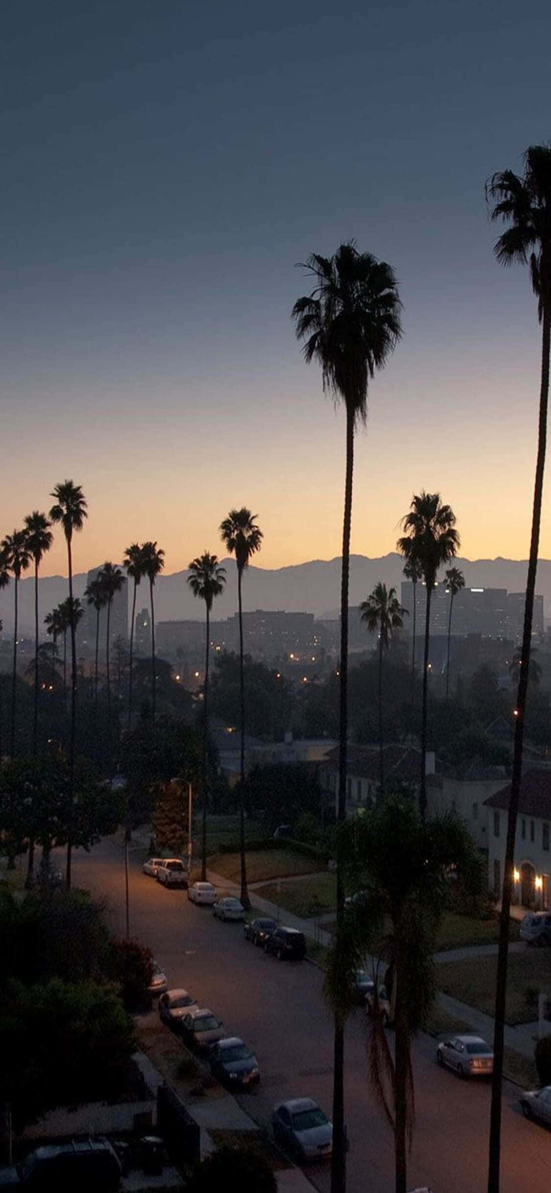 Bilde: Nyt California-solnedgangen mens du tar et bilde med din iPhone X Bakgrunner