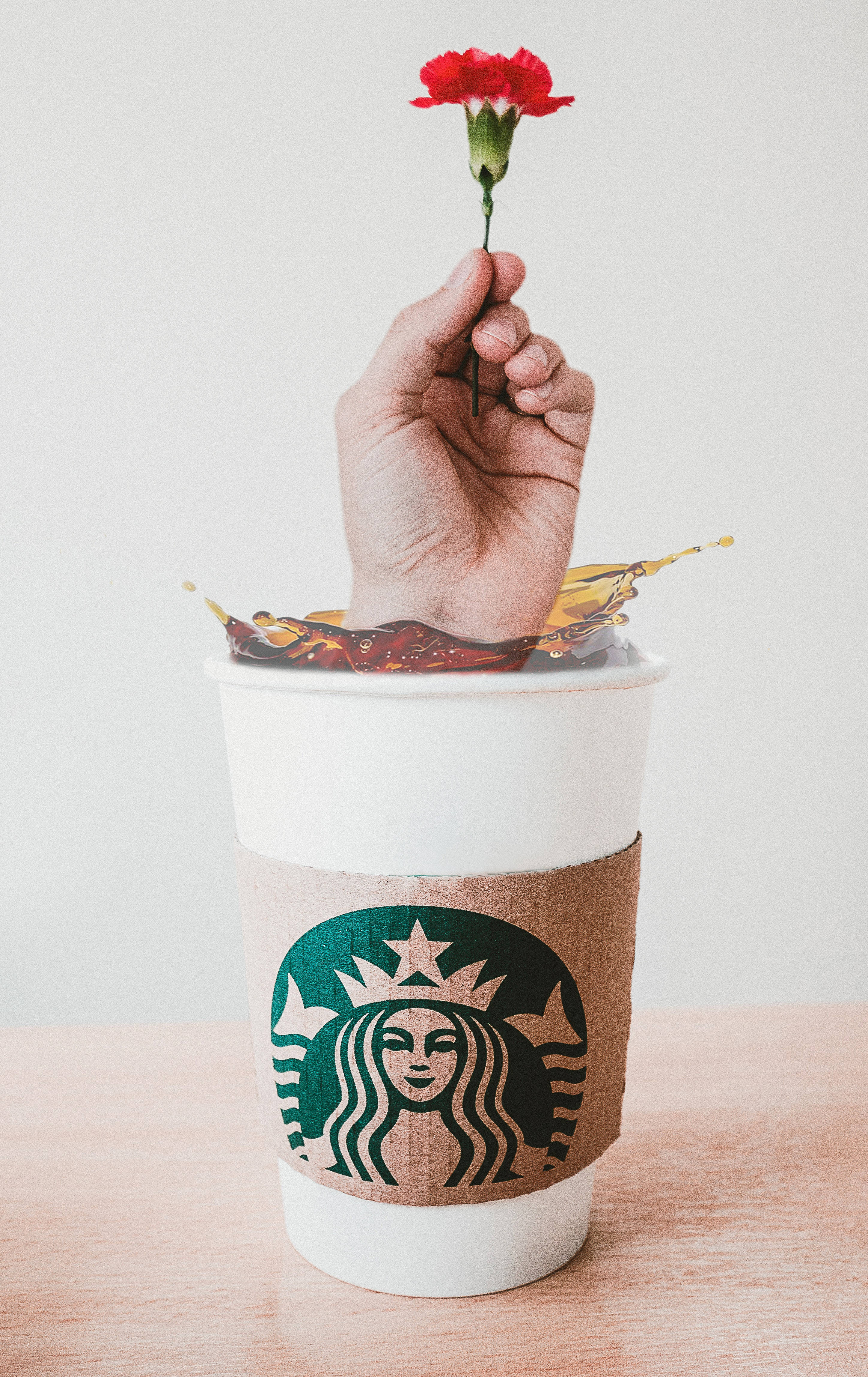 Bildetekst: Berik kaffeopplevelsen med Starbucks på iPhone Bakgrunner