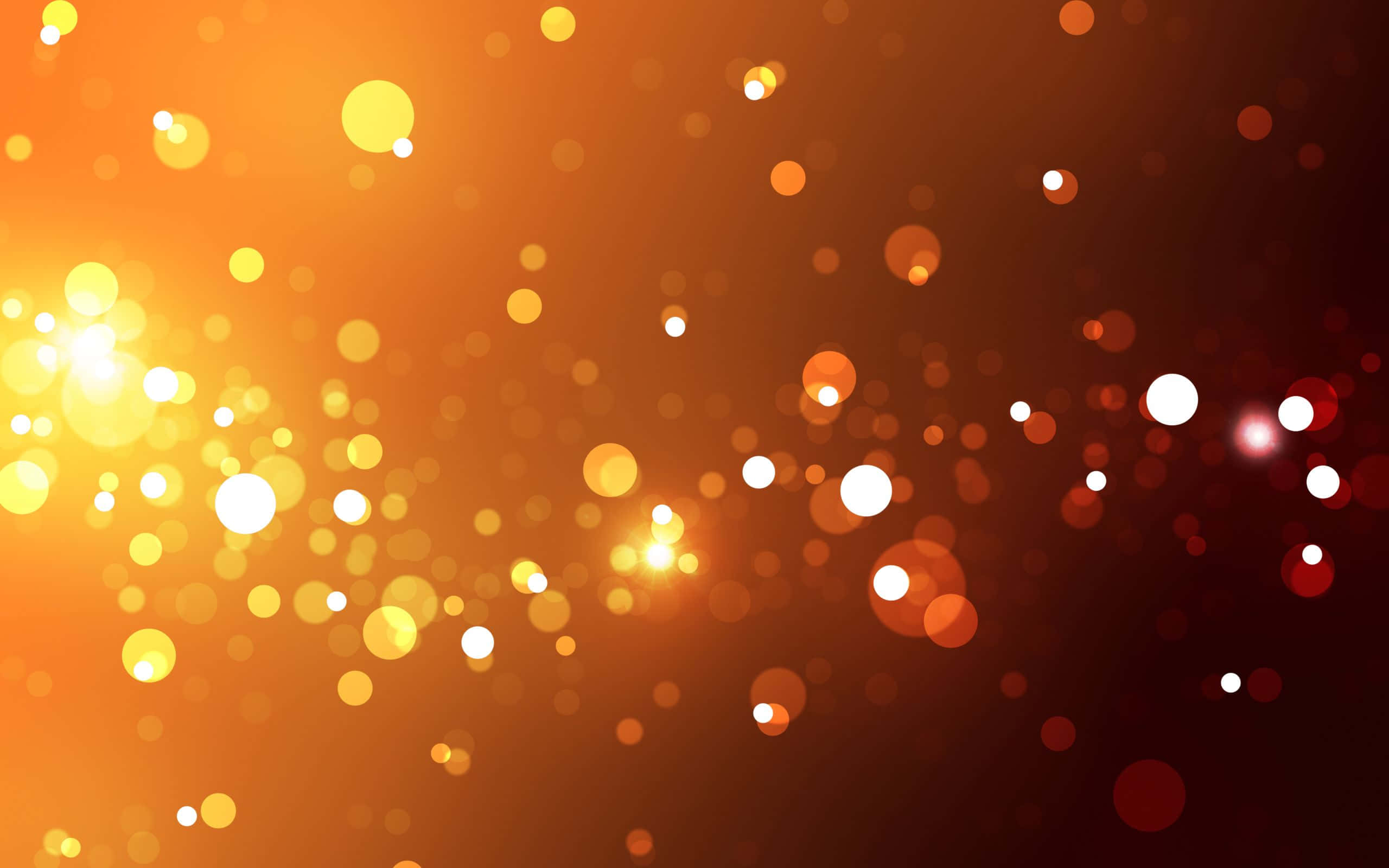 Bokeh-effekter i svart og oransje bakgrunn Bakgrunner