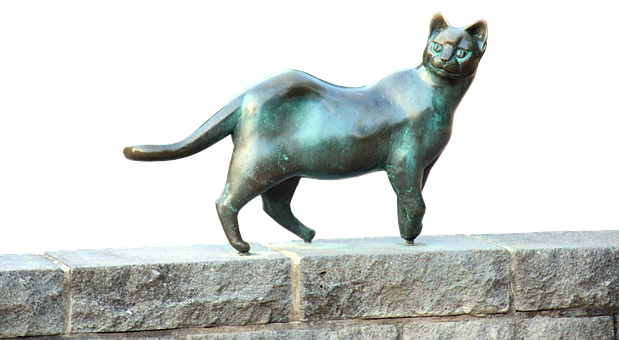 Bronse katteskulptur på steinhyller Bakgrunner