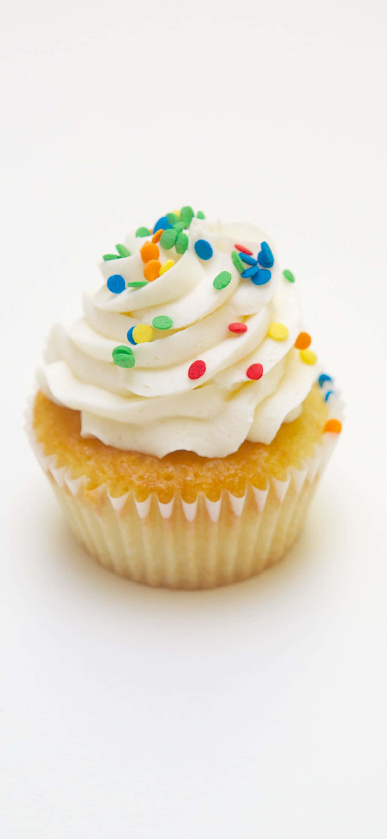 en hvit cupcake med hvit glasur Bakgrunner