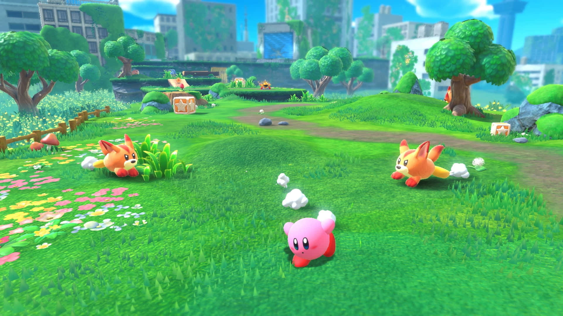 En søt Kirby-karakter sitter på en haug med fargerike stjerner Bakgrunner