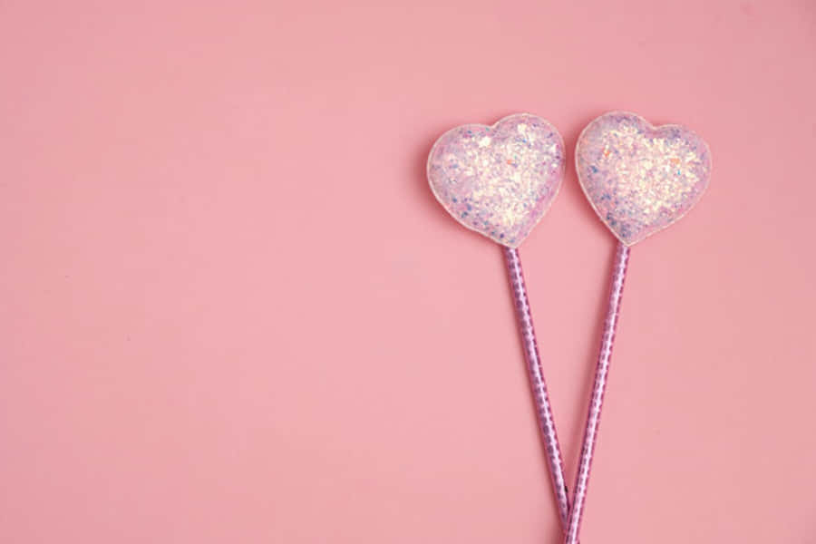 Et rosa, glitrende fossefall av hjerteformet konfetti Bakgrunner