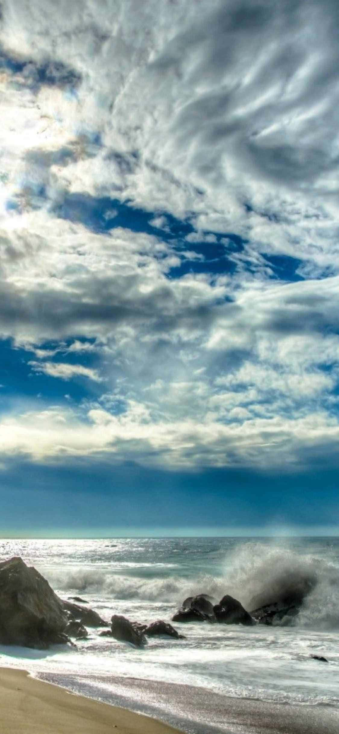 "Fang de gylne solnedgangene i Malibu på din iPhone Xs!" Bakgrunner