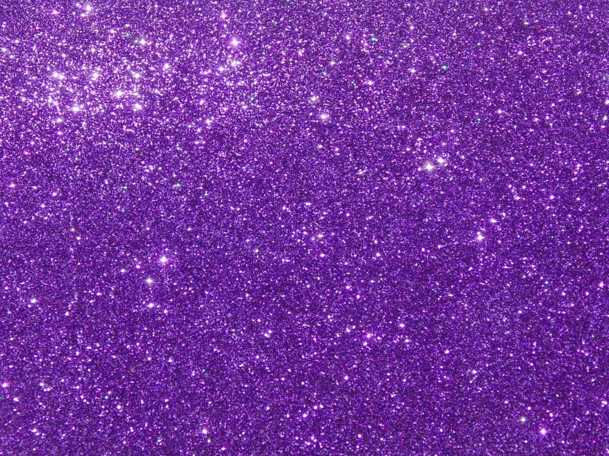 Funklende sømløs lilla glitterbakgrunn Bakgrunner