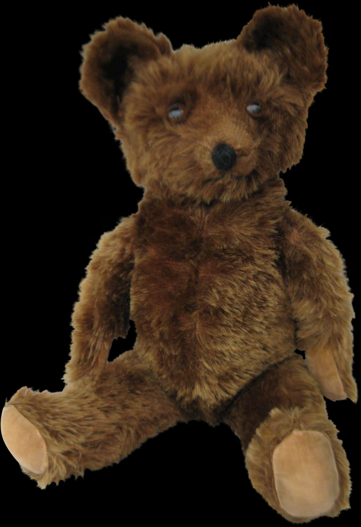 Gammel brun teddybjørn på svart bakgrunn Bakgrunner