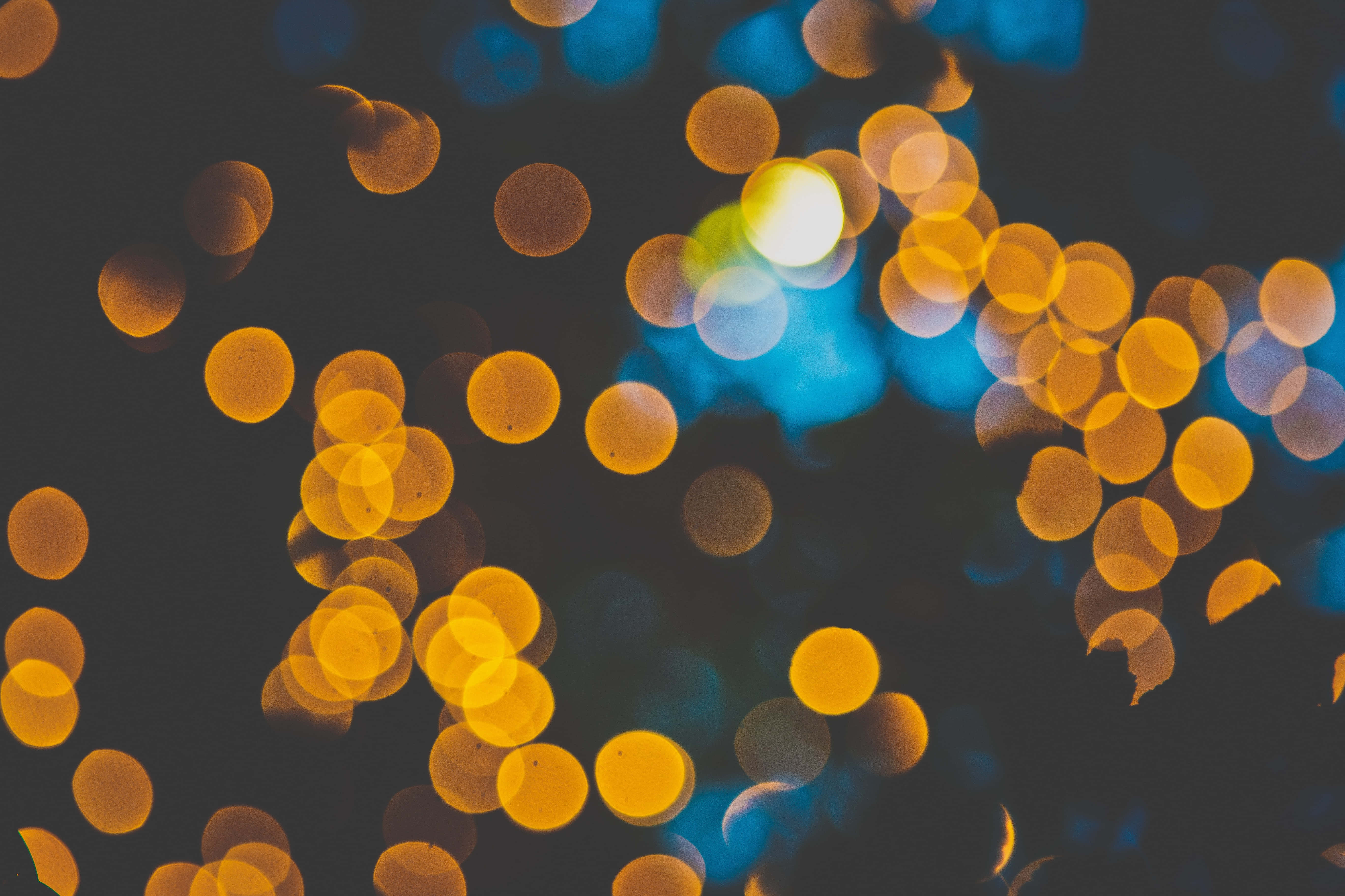 Gule og blå bokeh-lys bakgrunn Bakgrunner