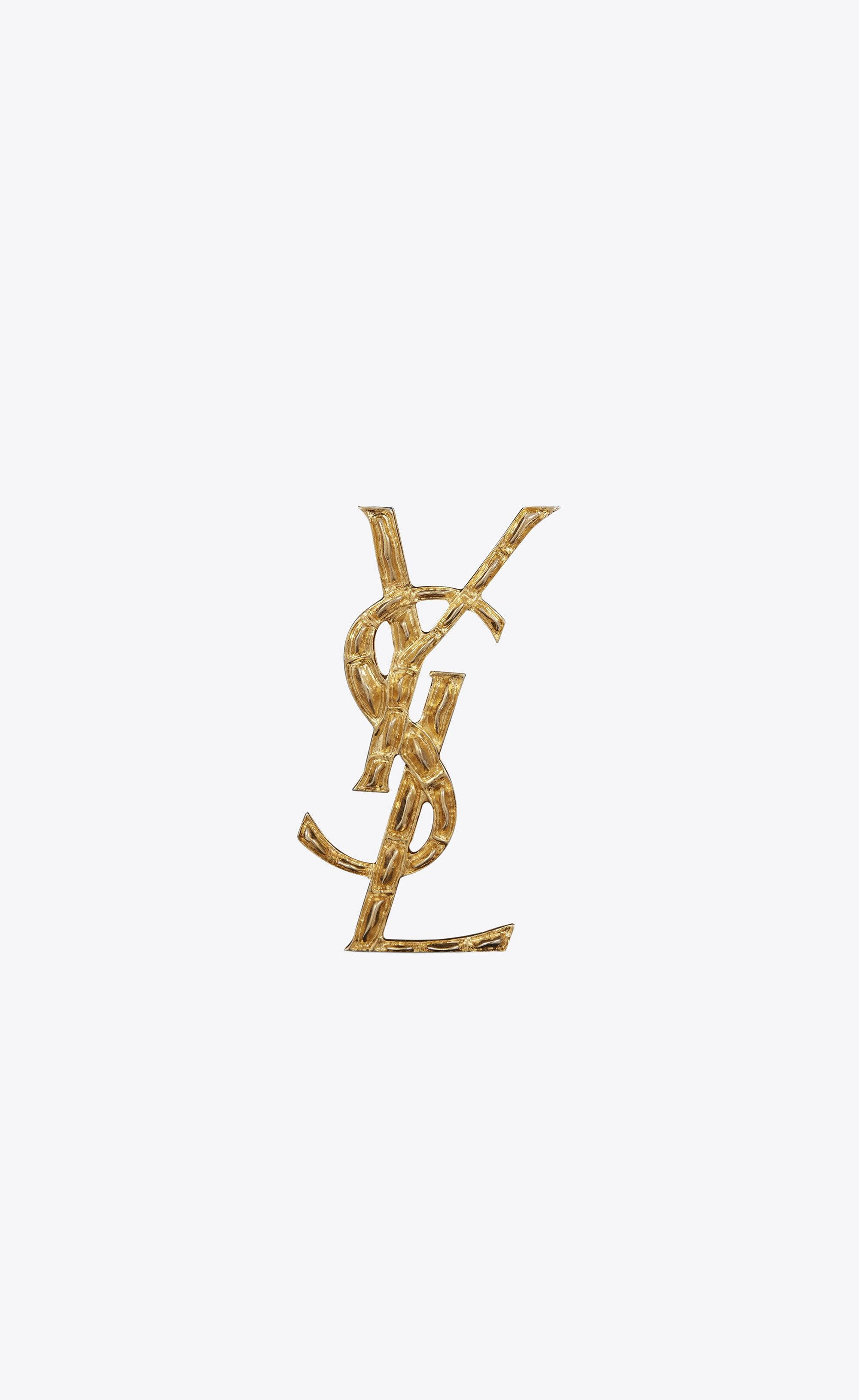 Gullkrokodille YSL brosje Bakgrunner