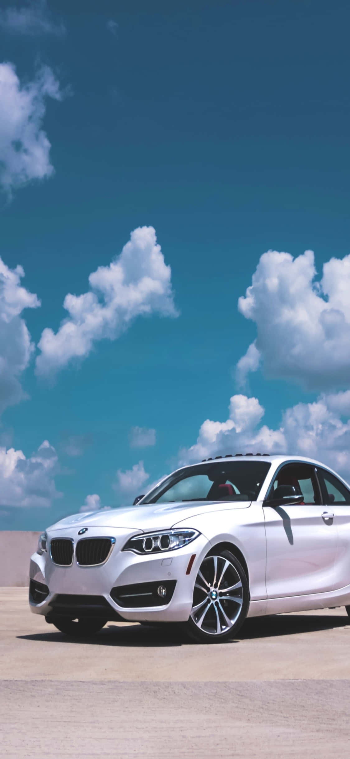 Innovativ design og teknologi: iPhone X og BMW Bakgrunner