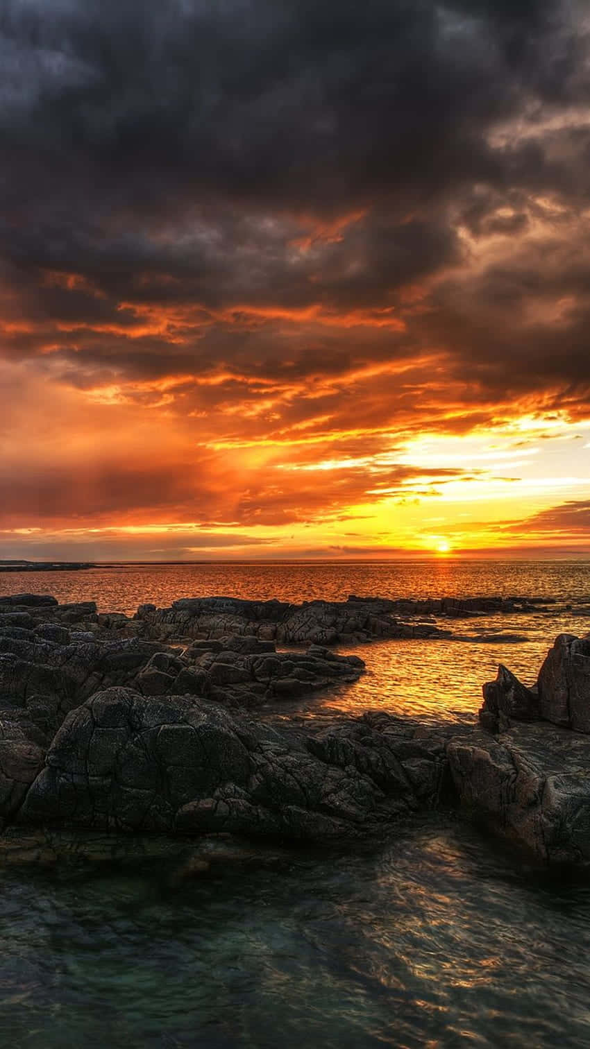 iPhone X Malibu-bakgrunn stormfull solnedgangshimmel Bakgrunner