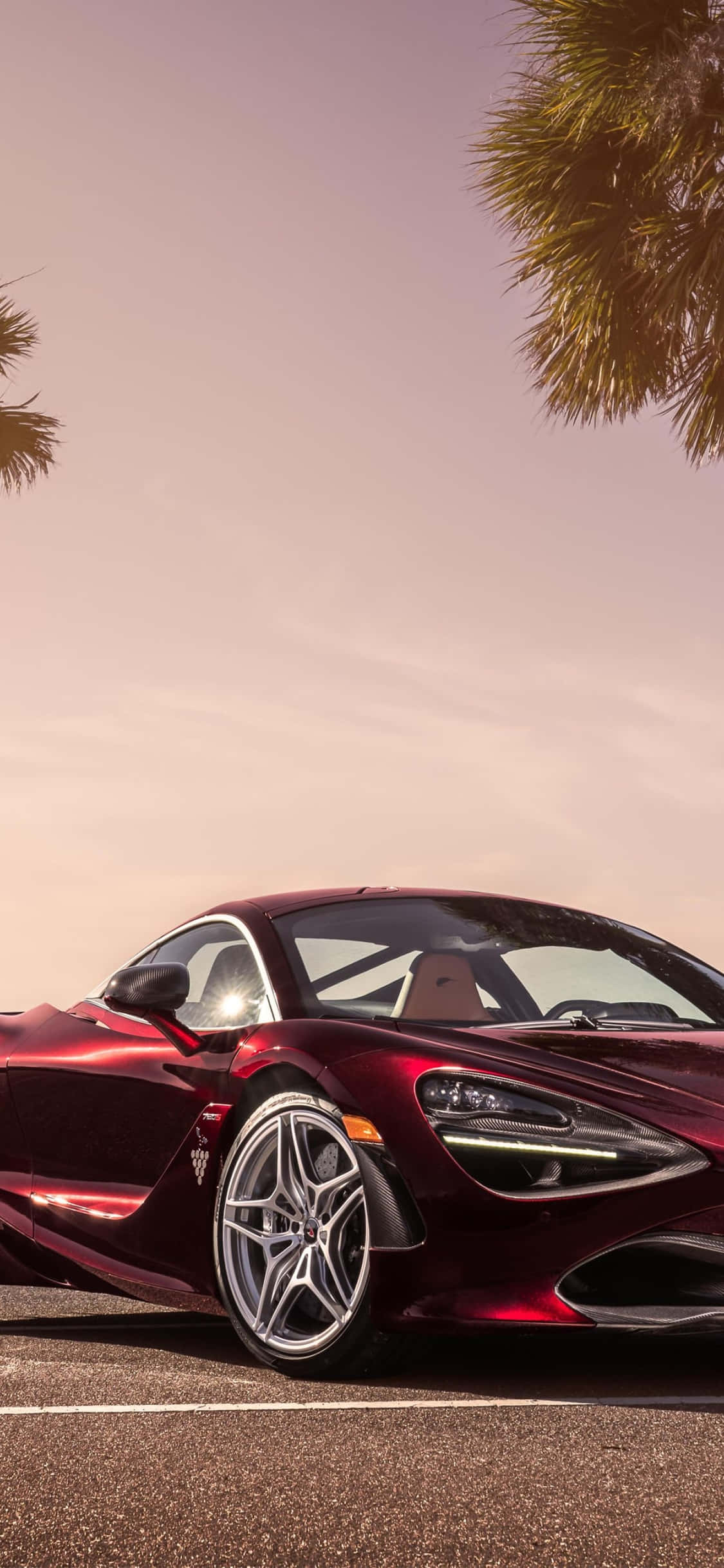 iPhone Xs og Mclaren 720s: Et Symbol på Luksus Bakgrunner