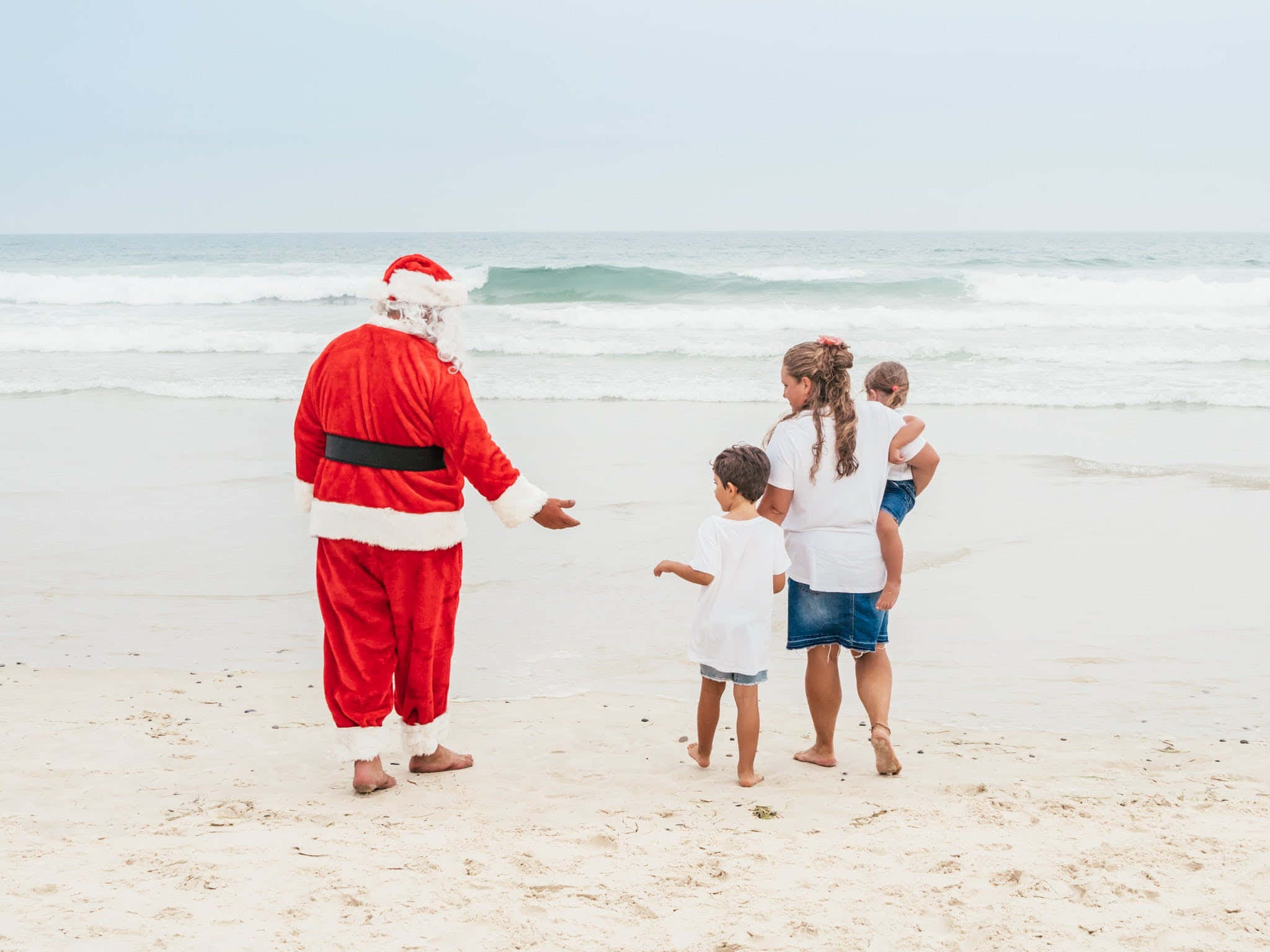 Julebilder av Julenissen på stranden Bakgrunner