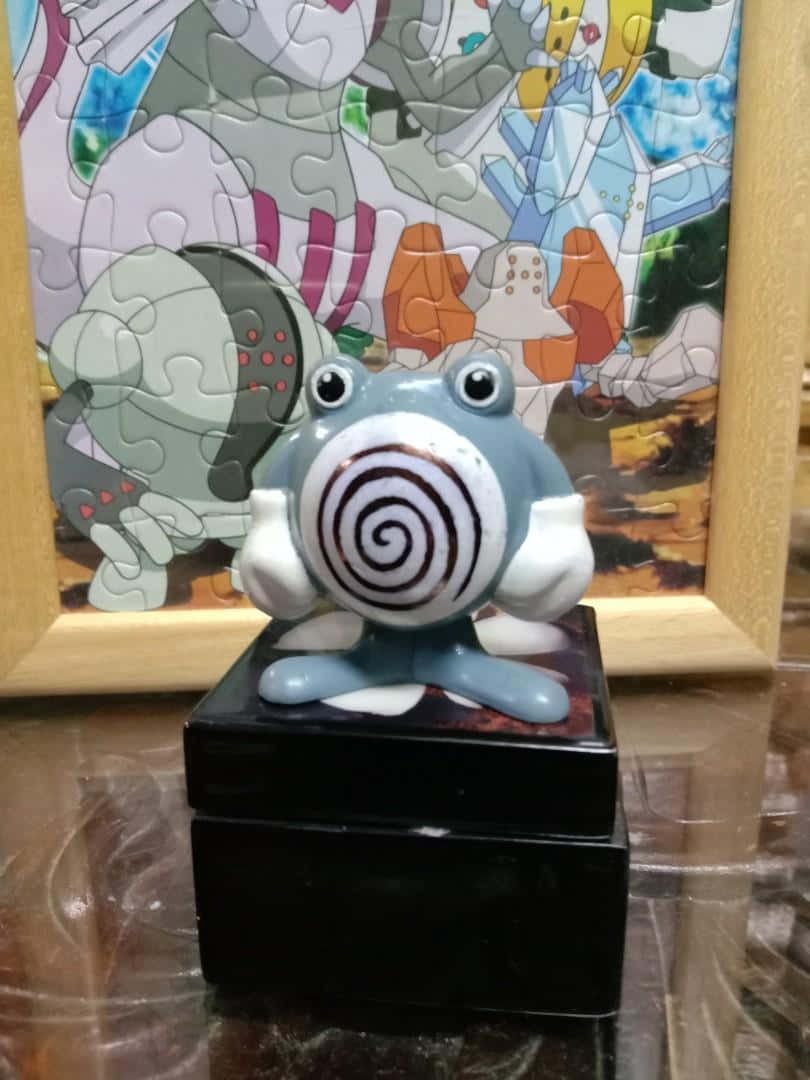 Keramisk Poliwhirl-statue Bakgrunner