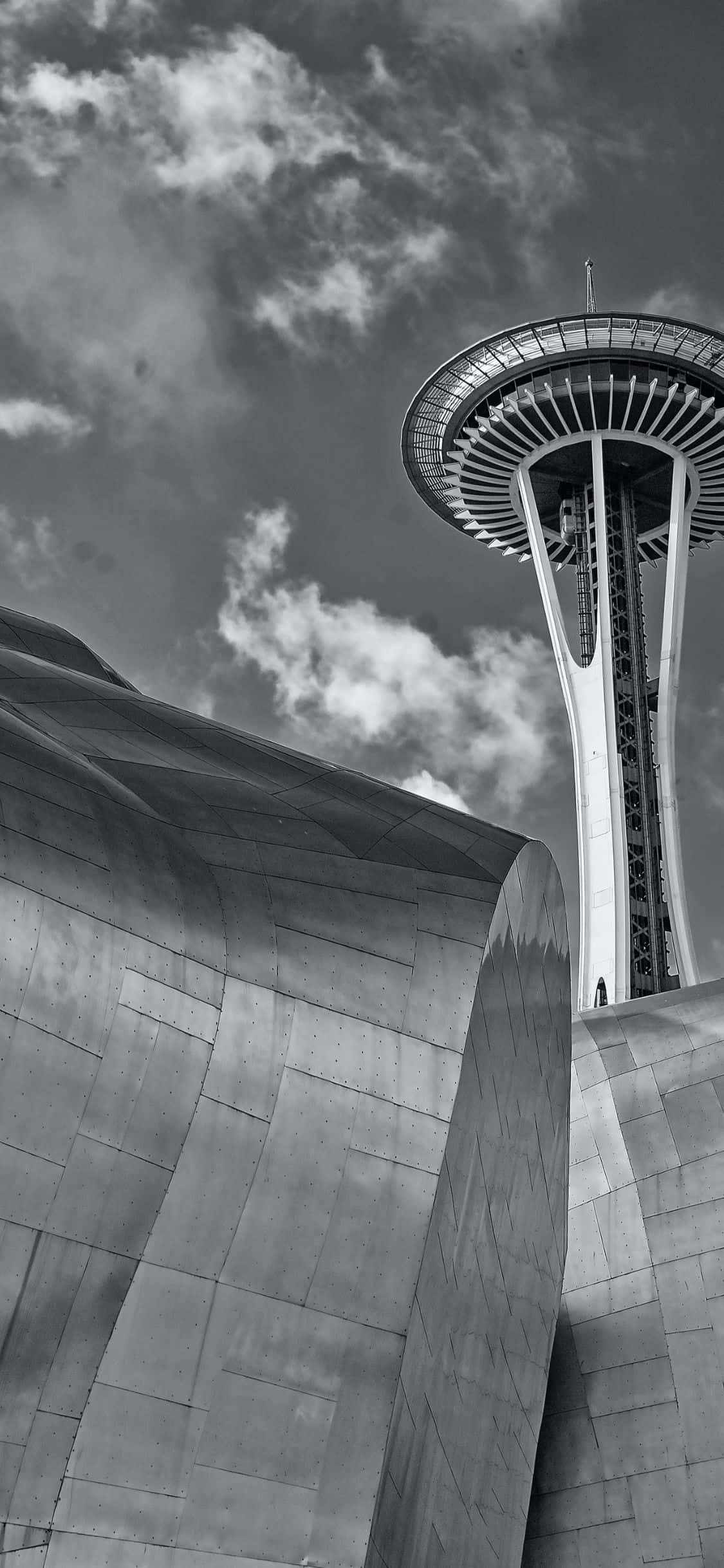 Nyt den fantastiske Seattle-himmelen og ikoniske Space Needle gjennom den bemerkelsesverdige skjermen på iPhone X. Bakgrunner