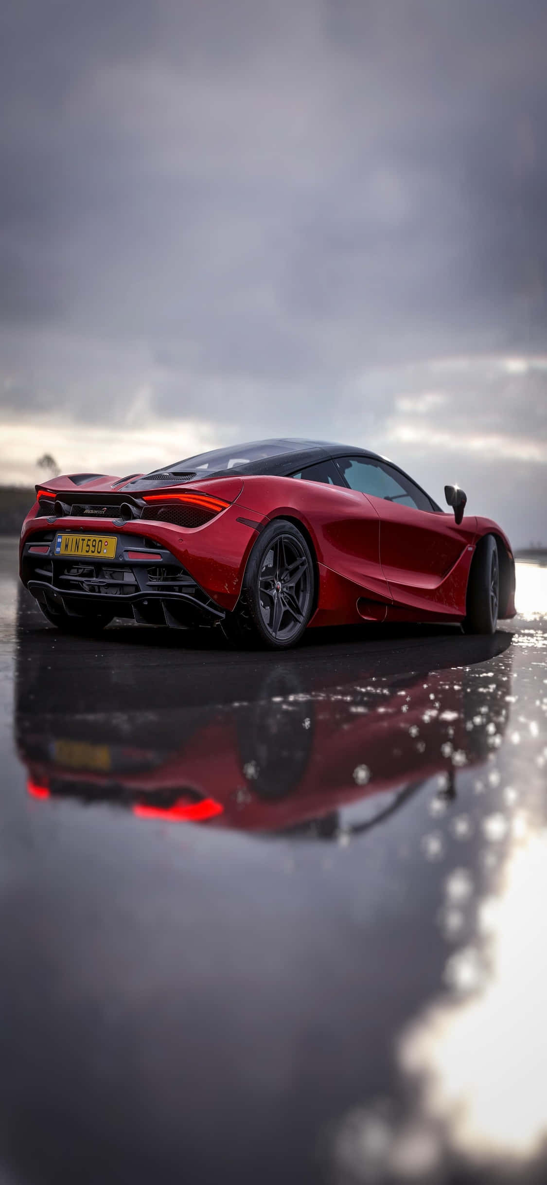Opplev farten og luksusen til iPhone Xs Mclaren 720s Bakgrunner