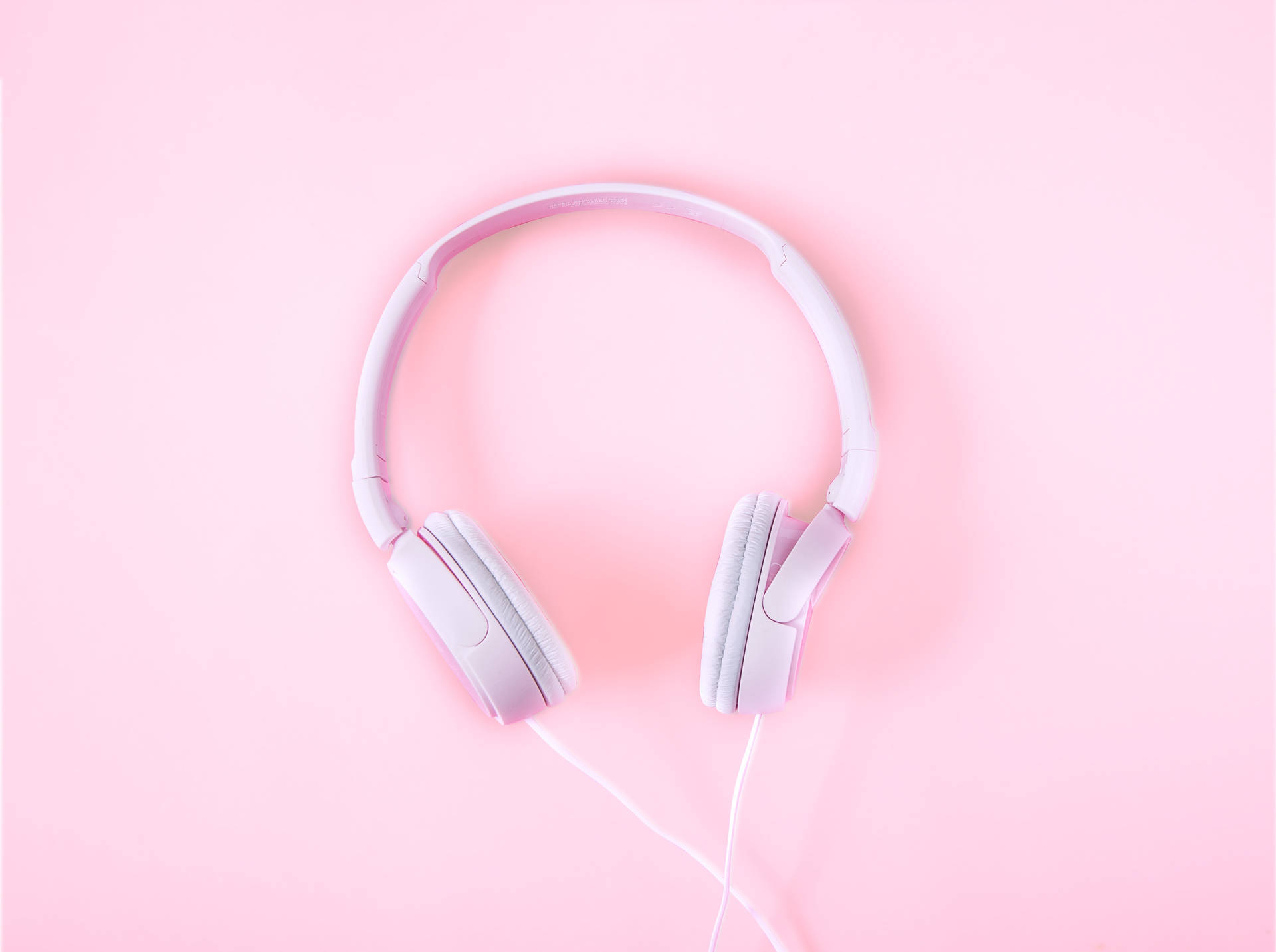 Enkel minimalistisk rosa hodetelefon bakgrunnsbilde.