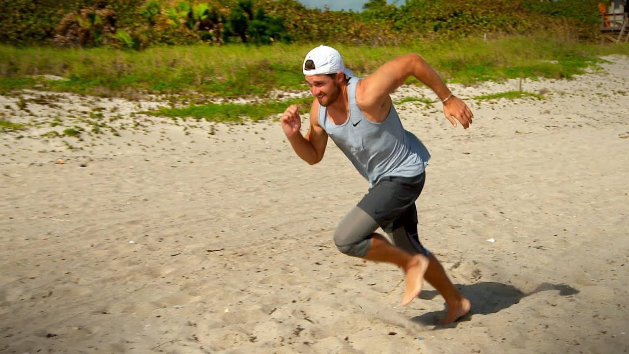 Patrick Rodgers Løper På Stranden Bakgrunner