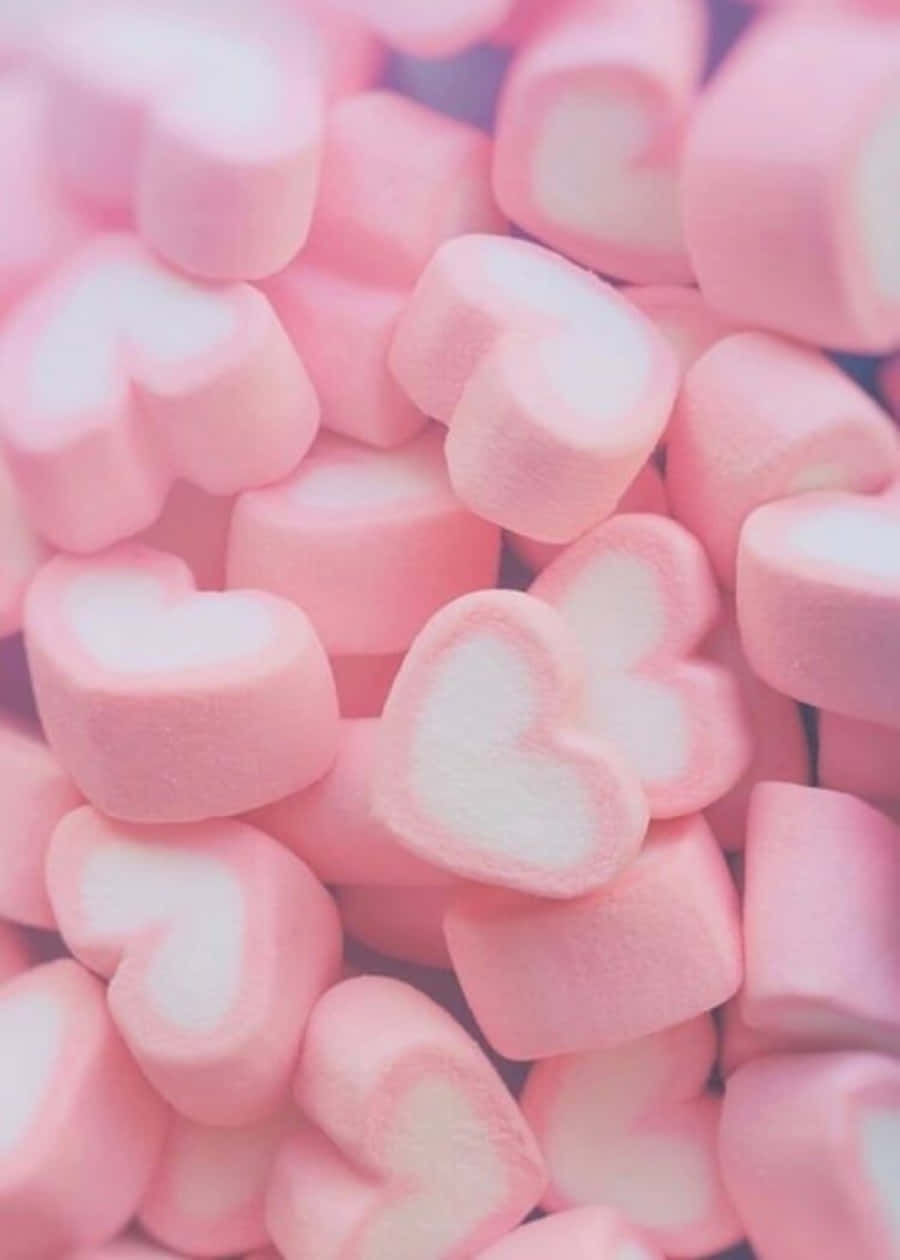 rosa marshmallows i en haug på hvit bakgrunn Bakgrunner
