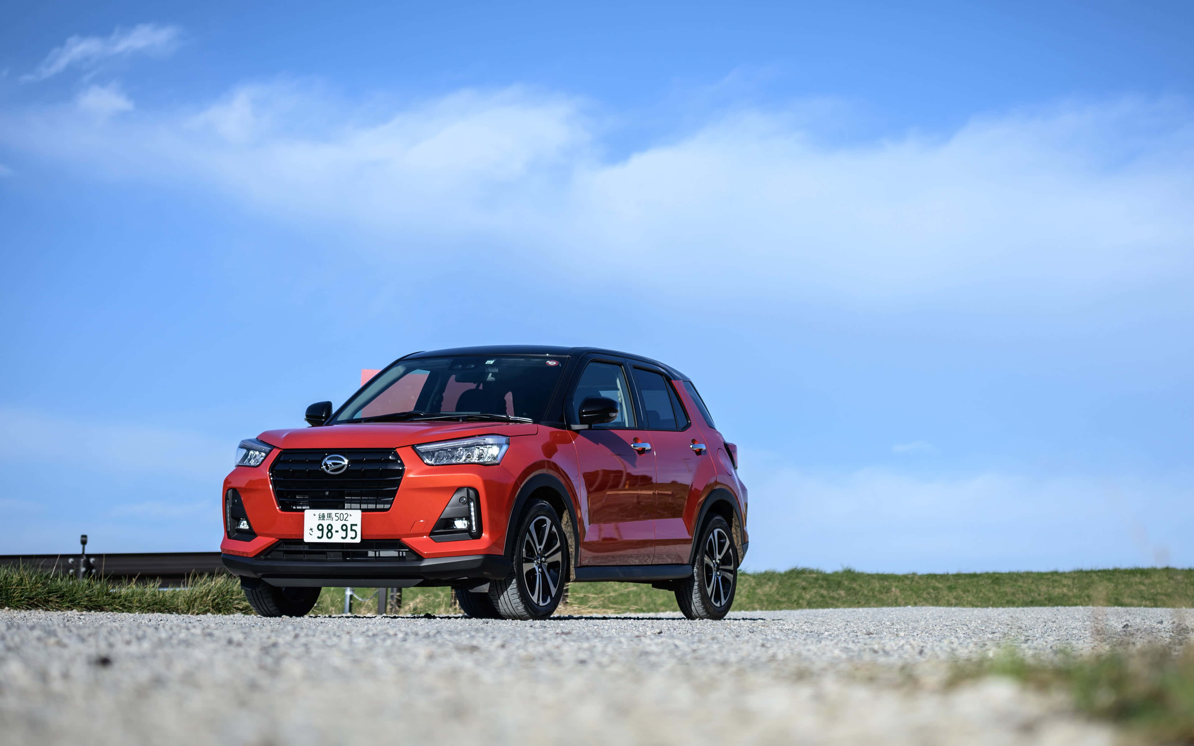 Slank og moderne Daihatsu-bil Bakgrunner