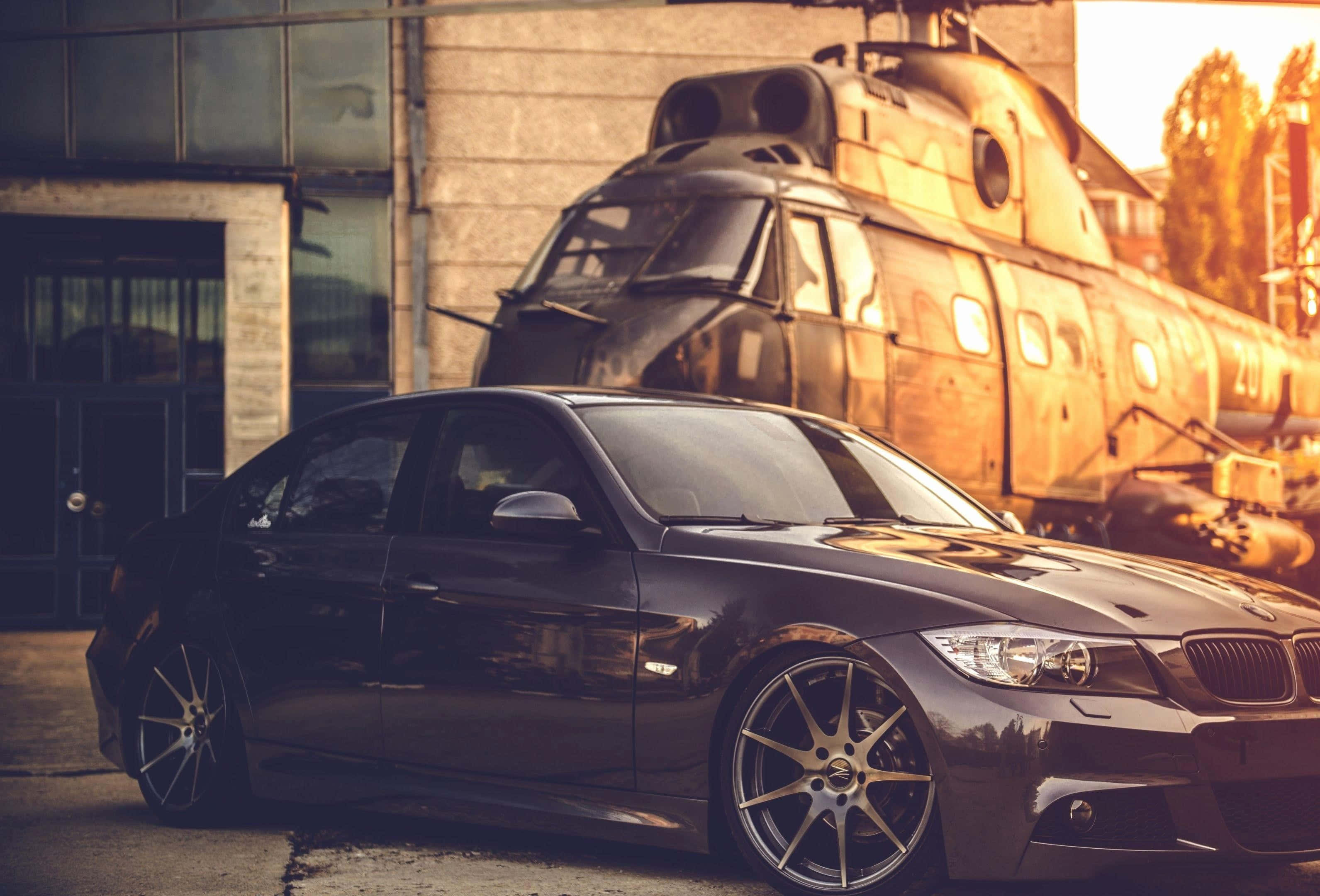 Sleek Tuned Car Showcased under Vibrant Lights Bakgrunner