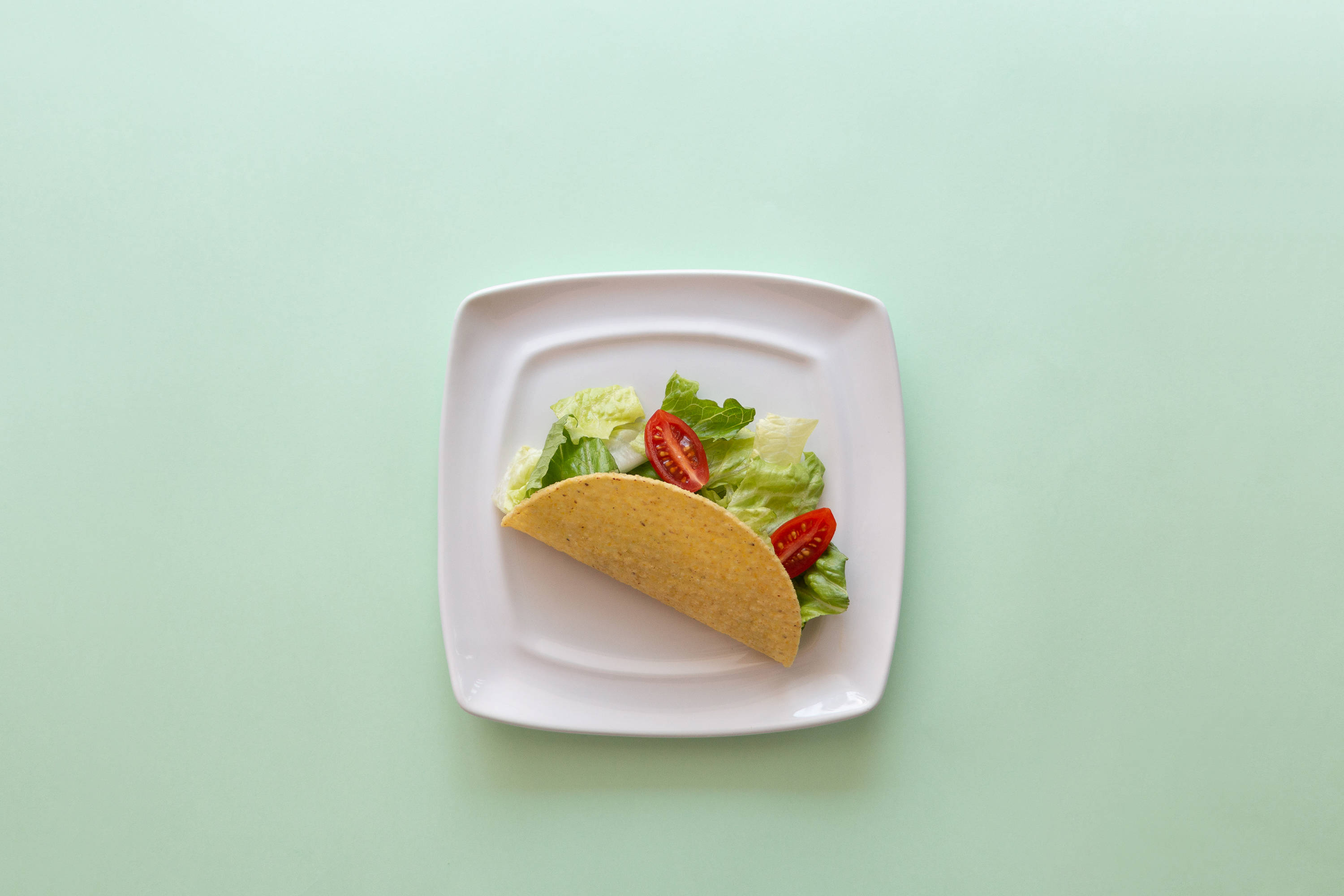 Taco på pastellgrønt bord Bakgrunner