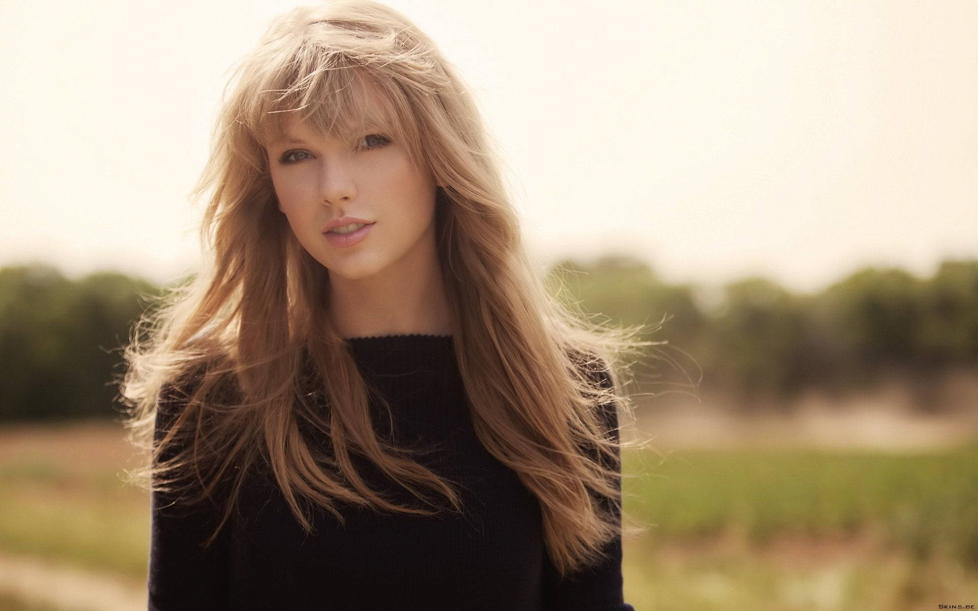 Taylor Swift stråler på scenen Bakgrunner
