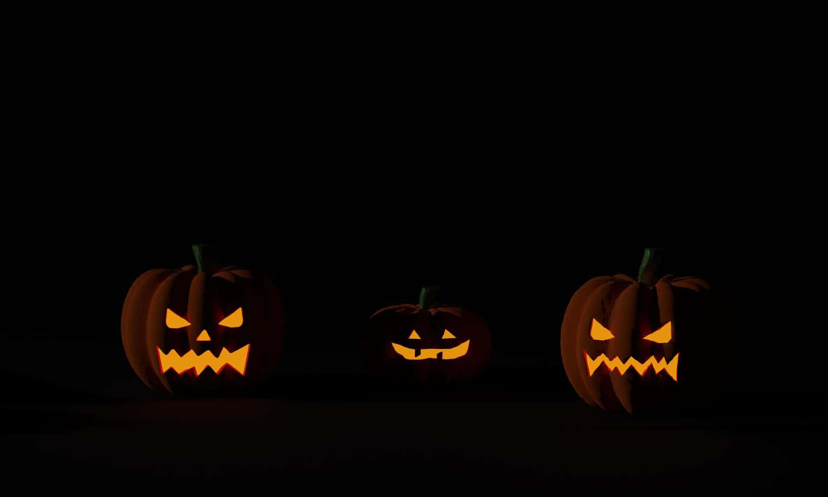 Tre Halloween-gresskar bakgrunn mørk Bakgrunner