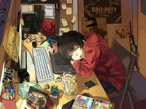 Animegutt sover ved laptopens styreflate