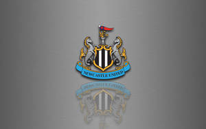 Newcastle United Football Club logo grå skrivebordsbakgrunn.