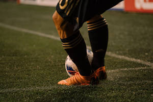 Fotballsko profesjonell fotballspiller skrivebordsbakgrunn.