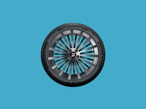 Høykvalitetsbilde av Bridgestone Turanza QuietTrack-dekk — Pastellblå Bakgrunner