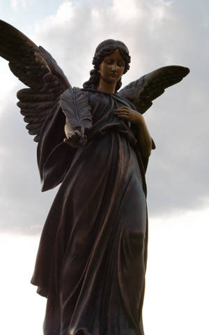 Katolsk bestilt engelstatue — Lenovo Idea Tab Plus Bakgrunner