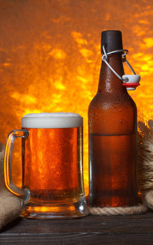 Ølflaske og halvliter med brown ale — Xiaomi Pad Mini Bakgrunner