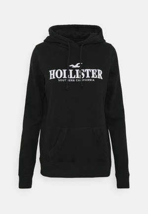 Hollister minimalistisk svart hettejakke bakgrunnsbilde — Nøytral Bakgrunner