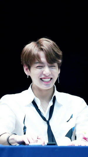 Søte BTS Jungkook som smiler på fanmøte