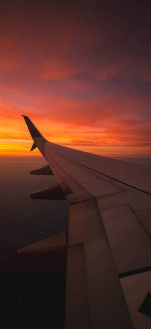 Solnedgang med vinge fra fly Android