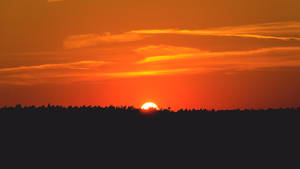 Bakgrunnsbilde med solnedgang over slettene — Pro Display XDR Bakgrunner