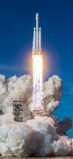 SpaceX Falcon Heavy-oppskytningsbakgrunn — iPhone 18 Pro Bakgrunner