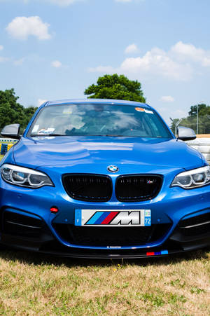 Vakker blå BMW på en racerbane — Xiaomi Pad Bakgrunner